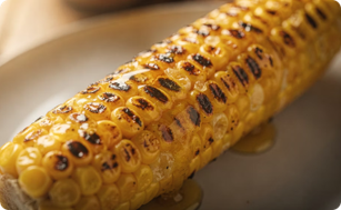 Elote dulce asado con mantequilla